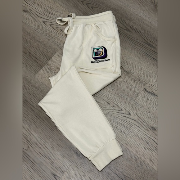 Disney Pants - Disney World Sweatpants  Joggers Stitched D Multicolor Logo Size L Cream NEW